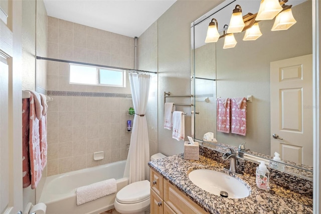 full bathroom with vanity, shower / tub combo with curtain, and toilet