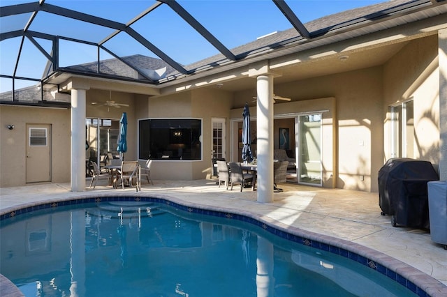 back of property featuring ceiling fan, a lanai, and a patio