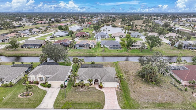 birds eye view of property with a water view