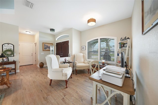 office space with light hardwood / wood-style flooring