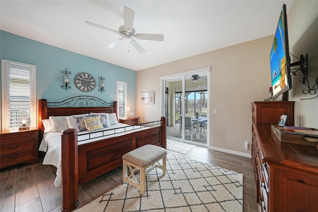 bedroom with wood-type flooring, access to outside, and ceiling fan