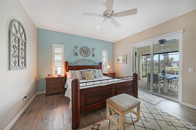 bedroom featuring hardwood / wood-style flooring, access to outside, and ceiling fan