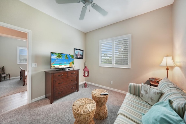 living room with ceiling fan and light carpet