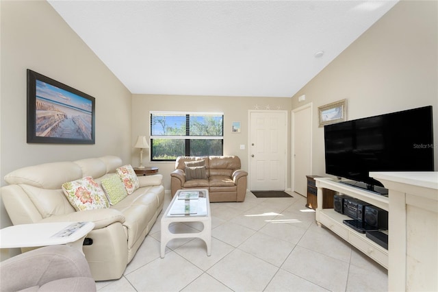 living room featuring light tile patterned flooring and vaulted ceiling