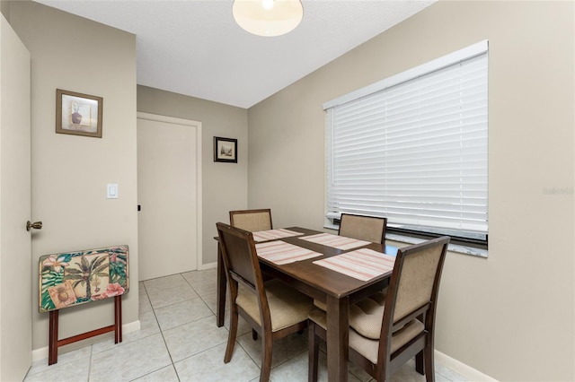 dining room featuring light tile patterned flooring