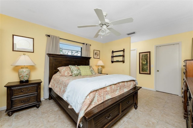 tiled bedroom featuring ceiling fan