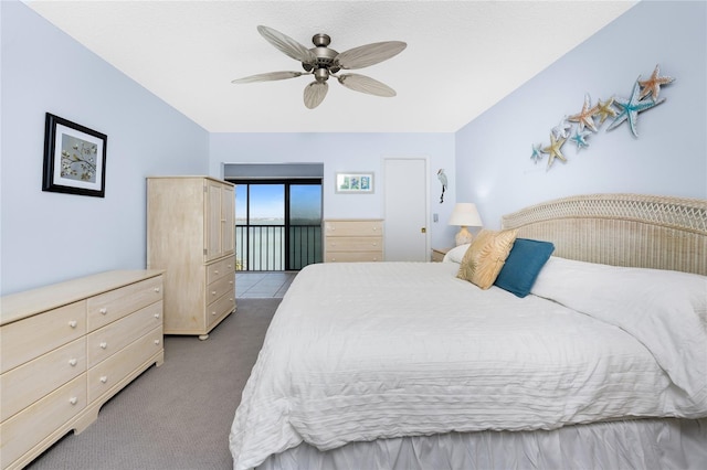 bedroom featuring ceiling fan and carpet