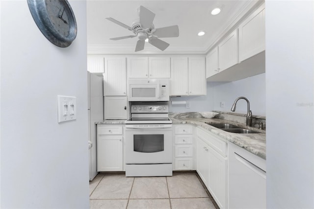 kitchen with light stone counters, light tile patterned flooring, a sink, white cabinetry, and white appliances