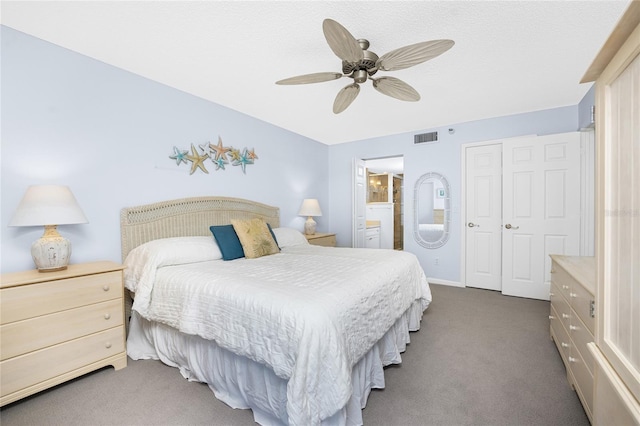 carpeted bedroom with baseboards, ceiling fan, visible vents, and connected bathroom