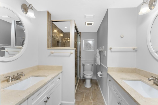 bathroom featuring two vanities, a sink, and a shower stall