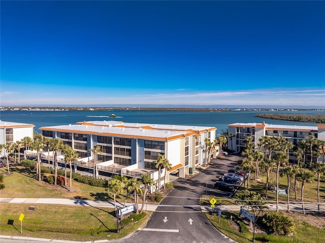 birds eye view of property with a water view