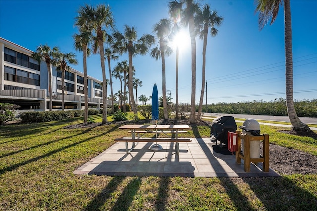 view of community with a patio area and a yard