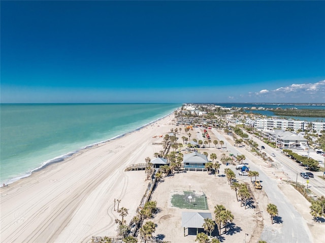 drone / aerial view featuring a water view and a beach view