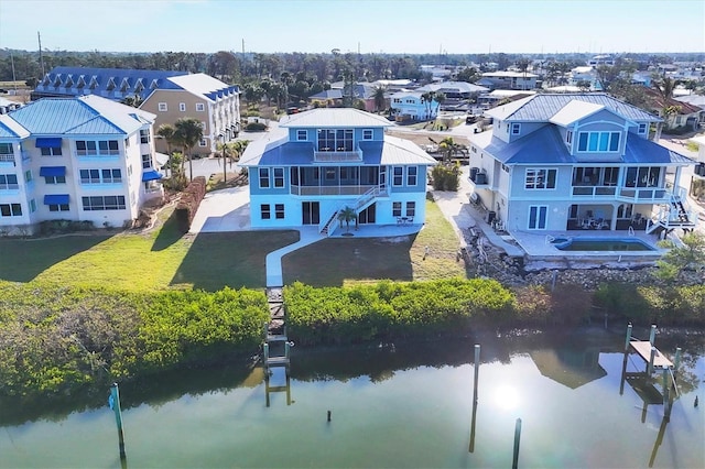 birds eye view of property featuring a water view