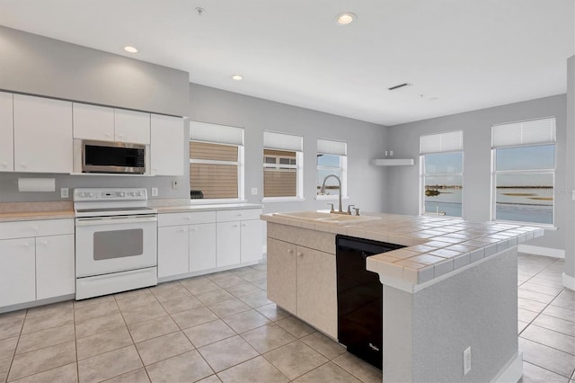 kitchen featuring white cabinetry, white range with electric cooktop, black dishwasher, and sink