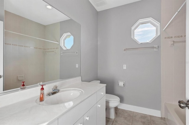 full bathroom featuring tile patterned floors, toilet, tiled shower / bath combo, and vanity