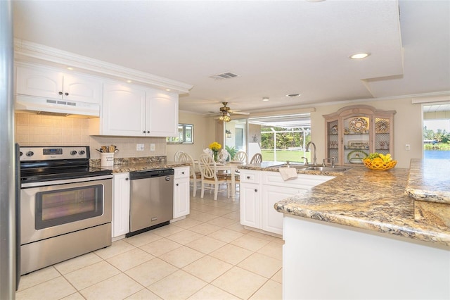 kitchen with white cabinets, under cabinet range hood, visible vents, and stainless steel appliances