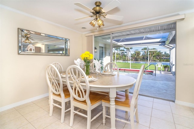 dining space featuring a sunroom, ceiling fan, light tile patterned floors, and ornamental molding