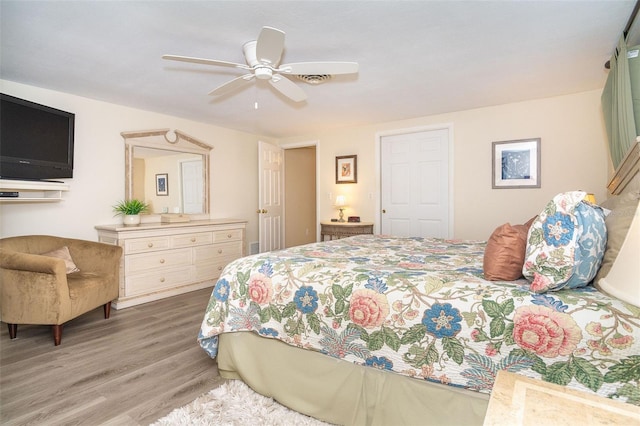 bedroom featuring a ceiling fan and wood finished floors