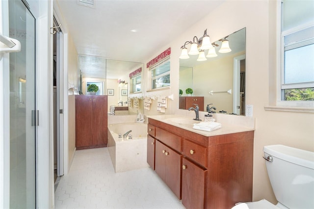 full bathroom featuring a garden tub, visible vents, toilet, a shower stall, and vanity