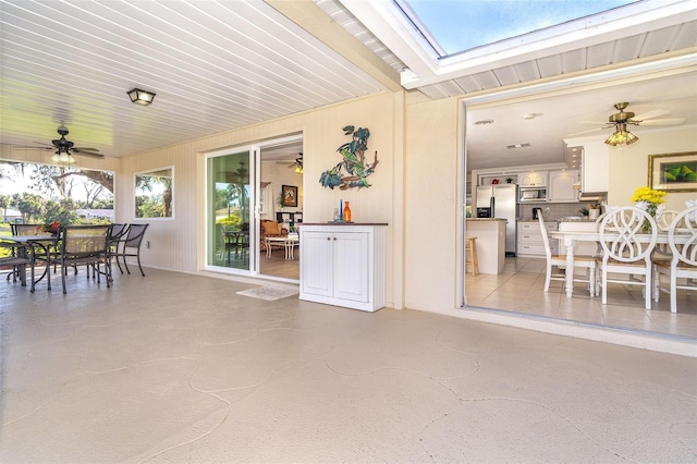 view of patio / terrace with ceiling fan and outdoor dining space