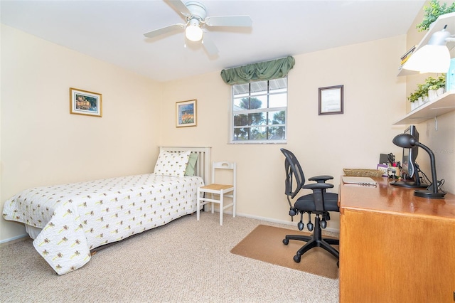 bedroom with a ceiling fan, baseboards, and carpet flooring