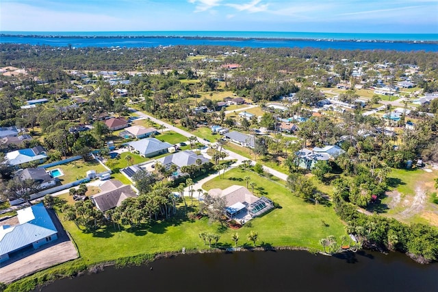 aerial view with a water view and a residential view