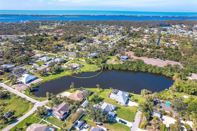 birds eye view of property with a residential view and a water view