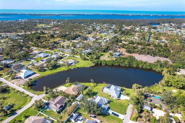 birds eye view of property featuring a residential view and a water view