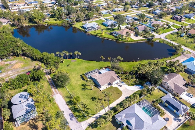 bird's eye view featuring a water view and a residential view