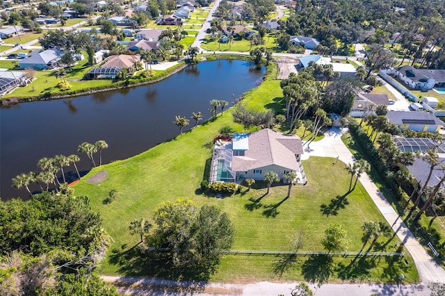 bird's eye view featuring a residential view and a water view