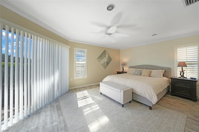 bedroom featuring crown molding, ceiling fan, and light wood-type flooring