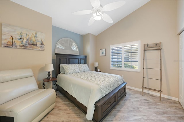 bedroom featuring vaulted ceiling, light hardwood / wood-style floors, and ceiling fan