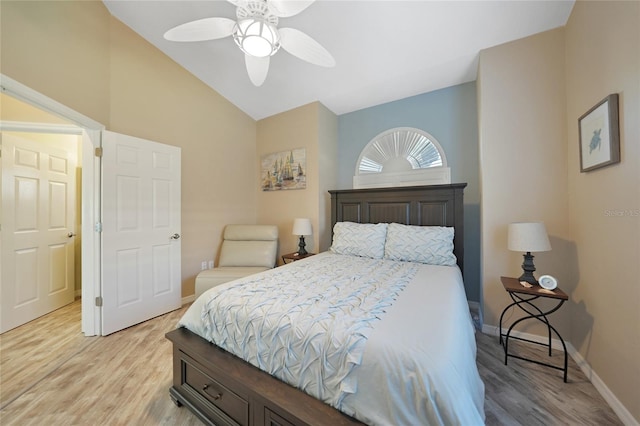 bedroom featuring vaulted ceiling, ceiling fan, and light wood-type flooring