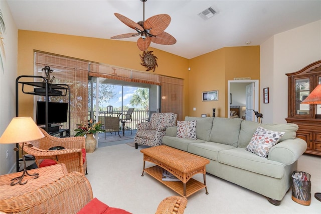 living room featuring carpet, lofted ceiling, and ceiling fan