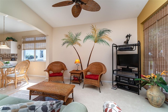 living room with light colored carpet and ceiling fan