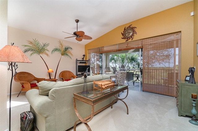 carpeted living room with lofted ceiling and ceiling fan