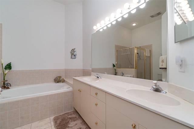 bathroom with vanity, tile patterned floors, and separate shower and tub