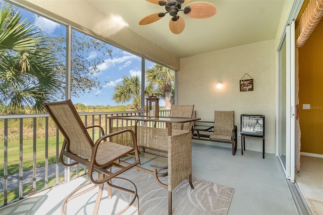 sunroom / solarium with ceiling fan