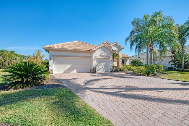 view of front of house featuring a garage and a front yard