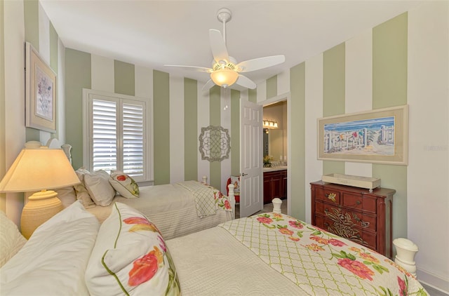 bedroom with ceiling fan and ensuite bath