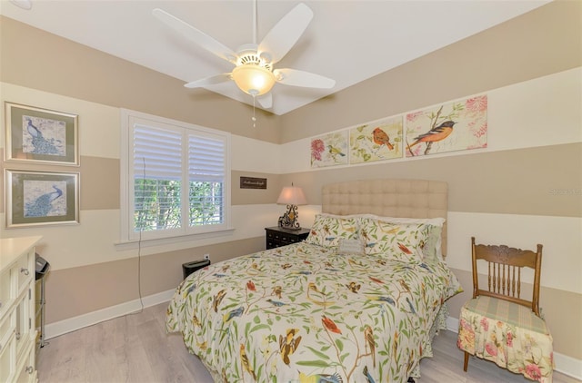 bedroom featuring ceiling fan and light hardwood / wood-style floors