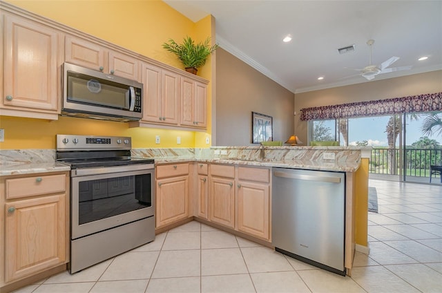 kitchen featuring crown molding, light brown cabinets, appliances with stainless steel finishes, kitchen peninsula, and light stone countertops