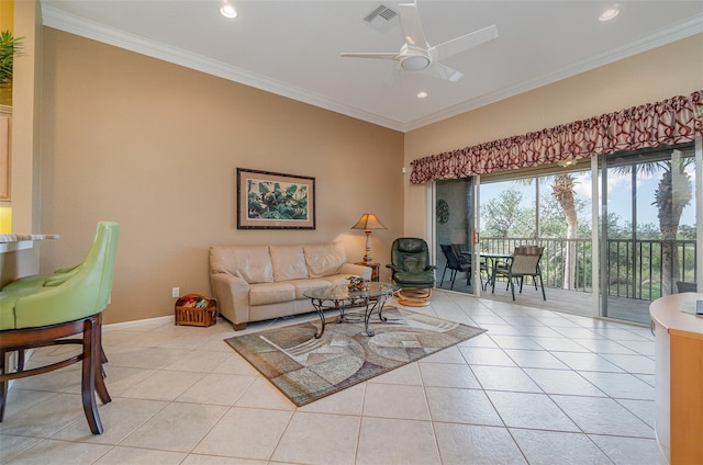 living room featuring crown molding, light tile patterned flooring, and ceiling fan