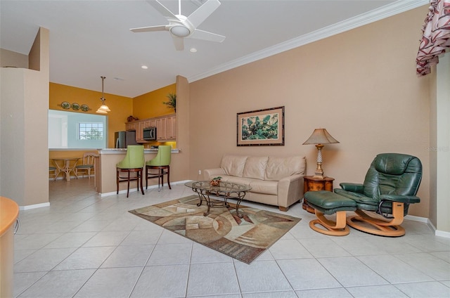 living room with ceiling fan, ornamental molding, and light tile patterned floors