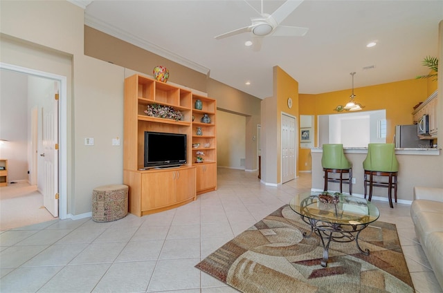 tiled living room featuring ceiling fan