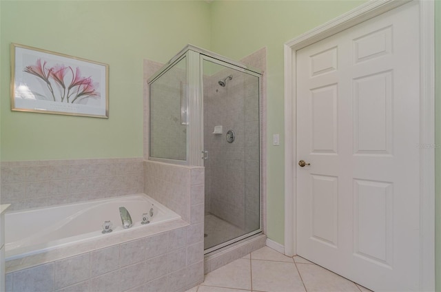 bathroom featuring shower with separate bathtub and tile patterned flooring