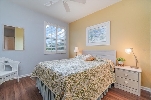 bedroom with ceiling fan and dark hardwood / wood-style floors