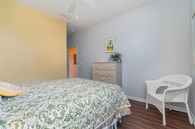 bedroom with ceiling fan and dark hardwood / wood-style flooring