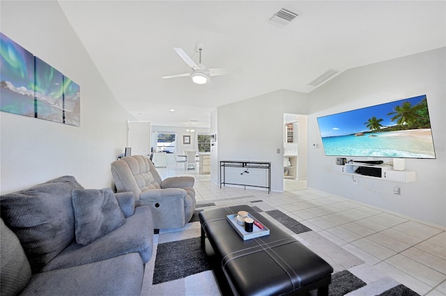 tiled living room with ceiling fan and lofted ceiling